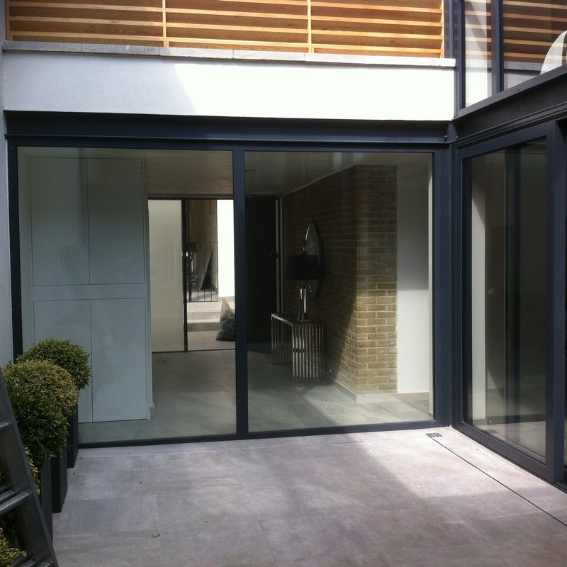 Floor-to-ceiling sliding doors opening to courtyard in Battersea