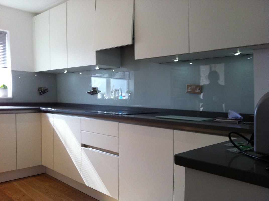 Grey glass kitchen splashback with LED lighting in Battersea