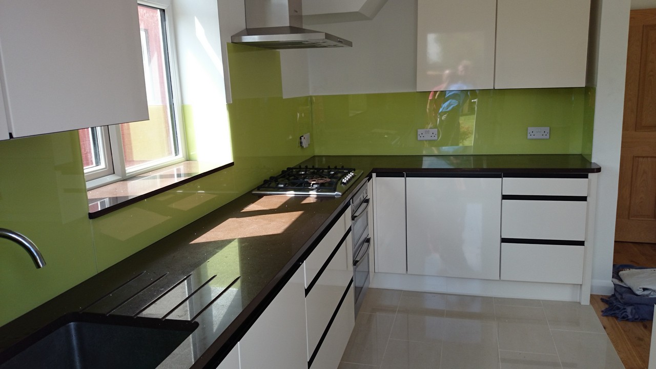 Lime green glass kitchen splashback installed by Battersea glaziers