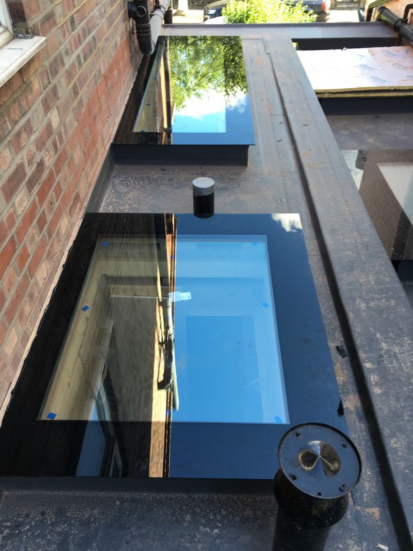 Multiple flat roof skylights on extension in Battersea