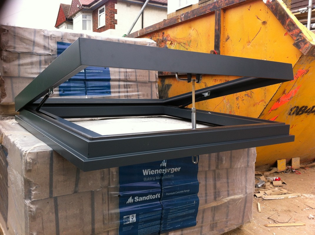 Opening flat roof skylight in anthracite grey installed in Battersea